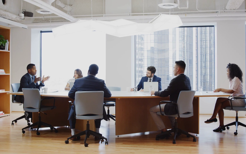 videoblocks-group-of-business-professionals-meeting-around-table-in-modern-office_rk1lzykgr_thumbnail-1080_01